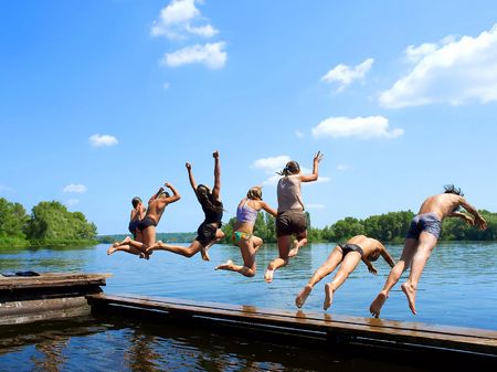 Jumping off for vacation in lake
